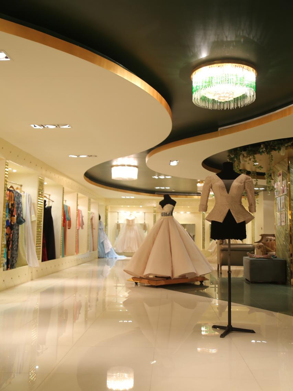 EVE haute couture floor with chandeliers and gowns